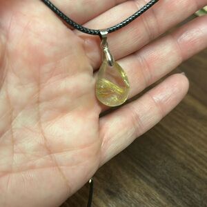 Rutilated gold quartz pendant.